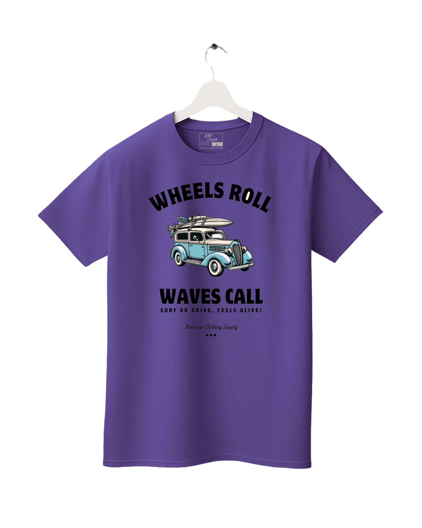 Purple t-shirt with a graphic of a car and surfboard, text 'Wheels Roll' and 'Waves Call', on a white background.